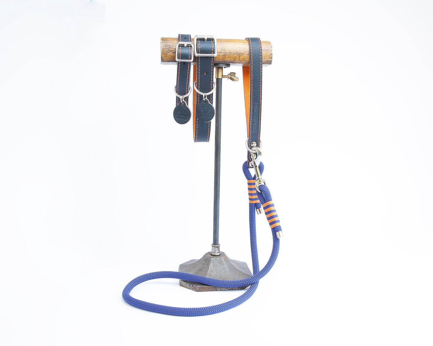 Handmade navy leather dog collars and matching lead with tangerine detailing from the Summer Fair Collection