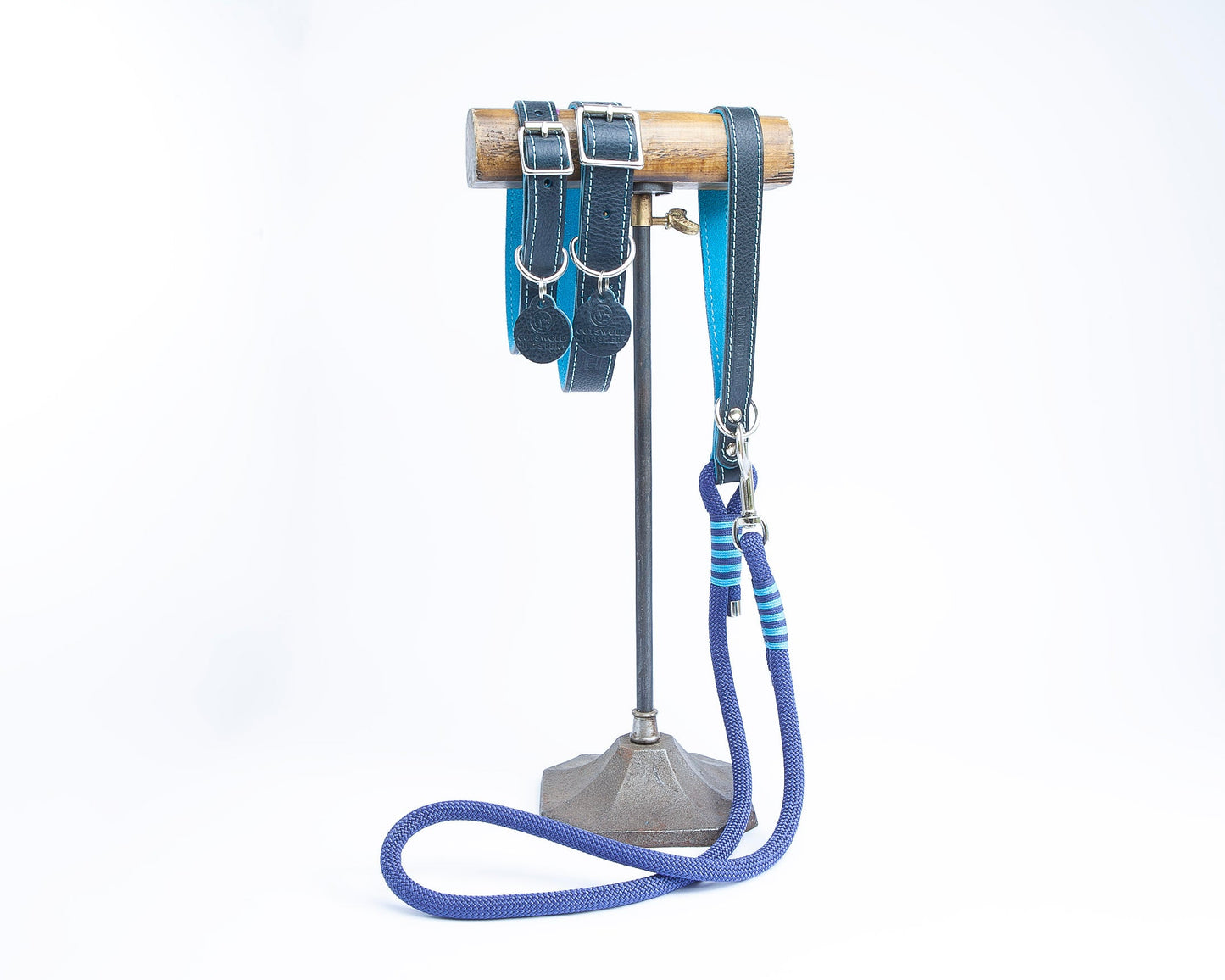 Handmade navy leather dog collars and matching lead with turquoise detailing from the Summer Fair Collection