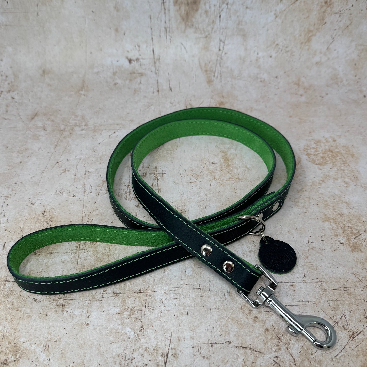 Summer Fair leather dog lead in navy with emerald suede lining and colour-matched stitching