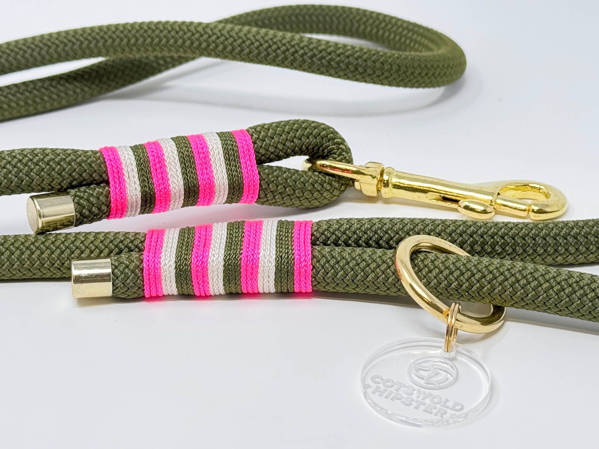 Close-up of BE SEEN! Neon Pink rope lead showing contrast whipping in army green, cream, and neon pink, solid brass hardware