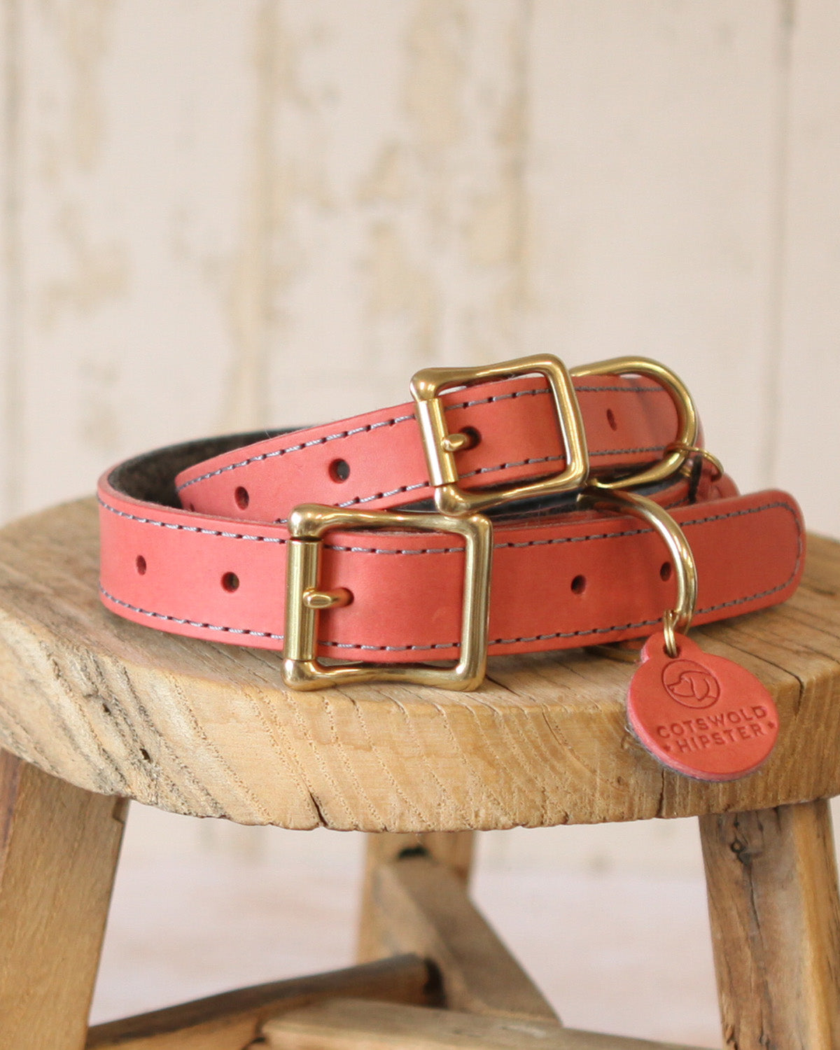 Medium and large coral and charcoal leather and felt dog collars from the limited edition collection.