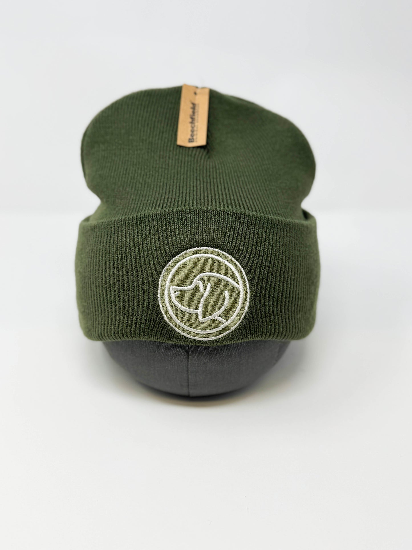 Cotswold green unisex beanie hat branded with Cotswold Hipster dog logo, cozy winter hat for matching dog collars and leads.