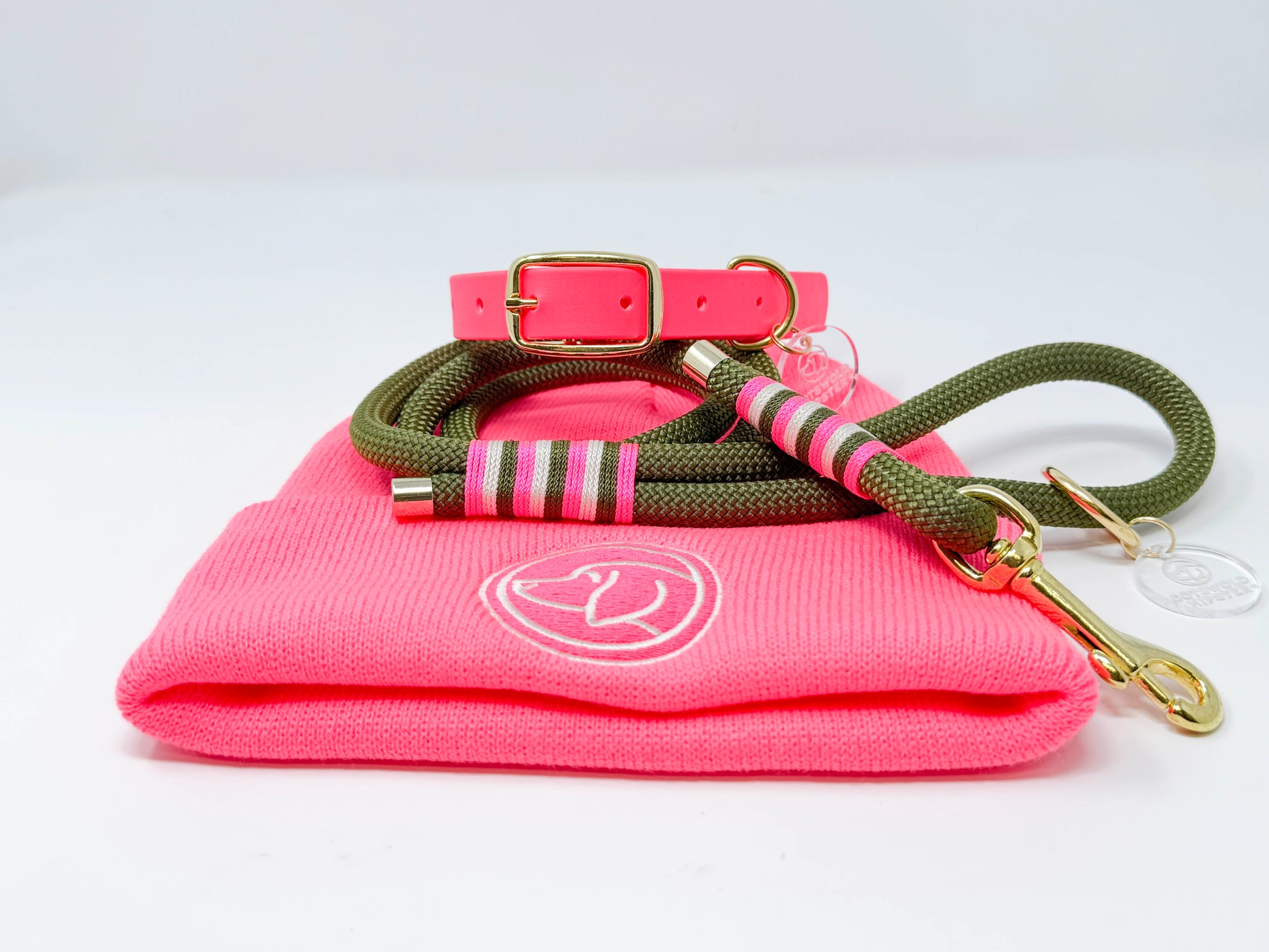 Coordinated Neon Pink BE SEEN! stack including beanie, dog collar, and rope lead showing mix-and-match styling
