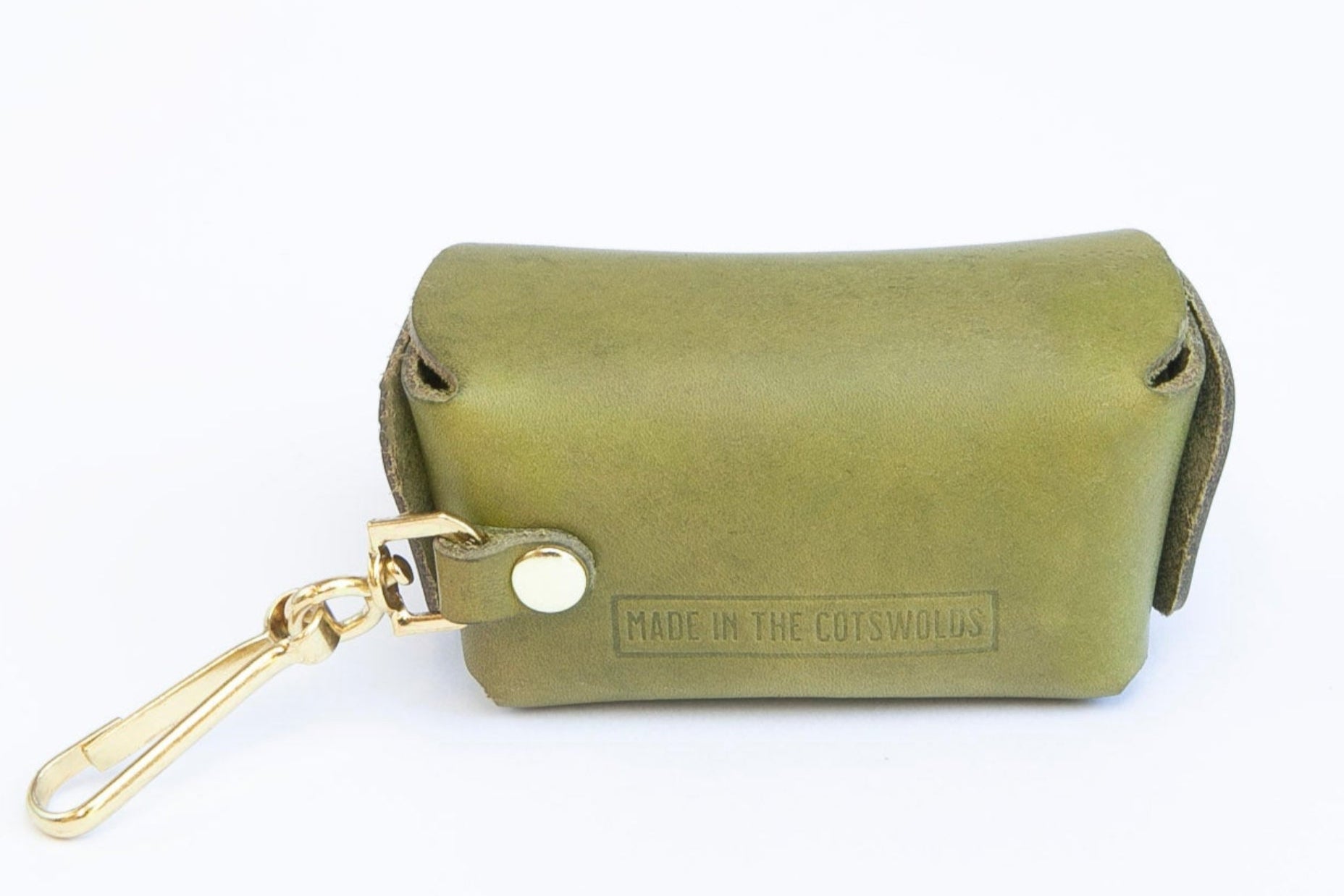Back view of Olive Green leather poop bag holder showing embossed branding and brass clip for attaching, made by Cotswold Hipster