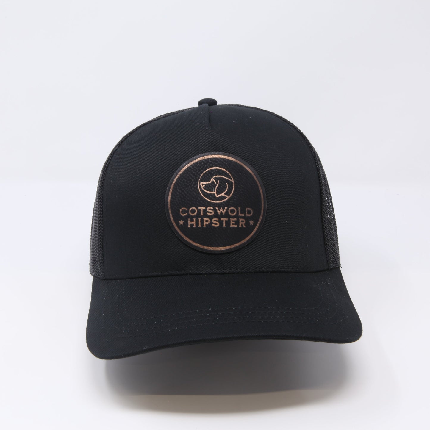 Front-facing black Field Cap on white background, showing logo patch and adjustable snap-back.
