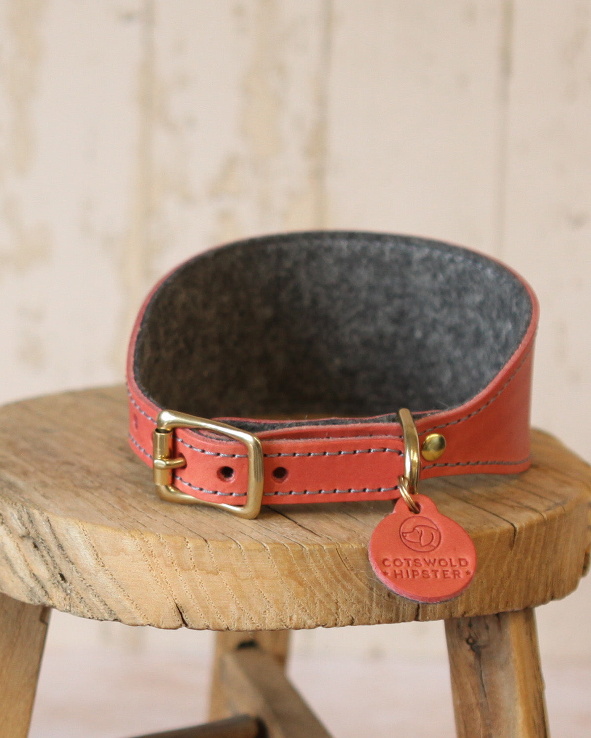 Close-up showing the soft charcoal wool felt lining of a coral and charcoal limited edition sighthound collar.