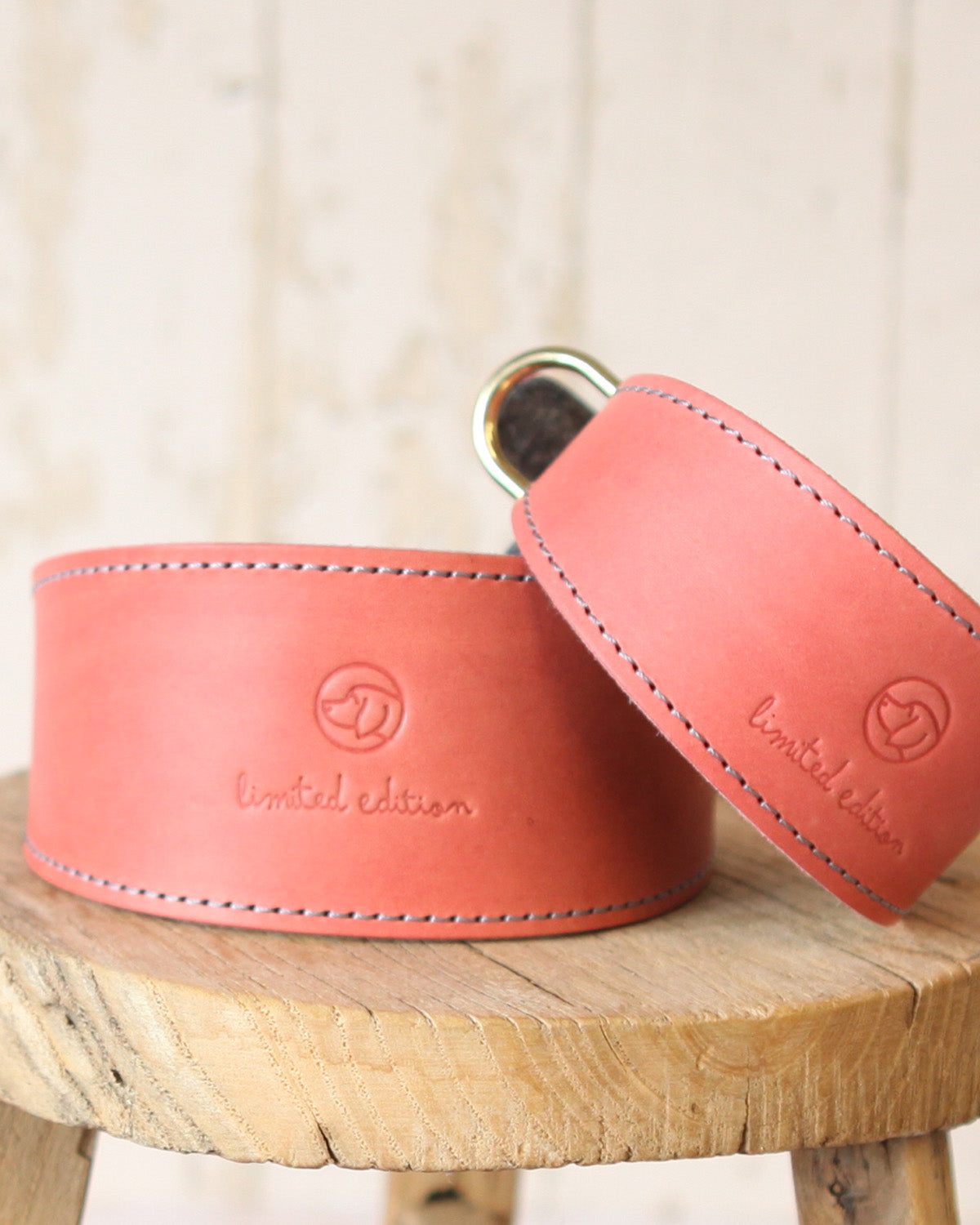 Medium and large coral and charcoal limited edition leather and felt sighthound collars handcrafted in the Cotswolds.