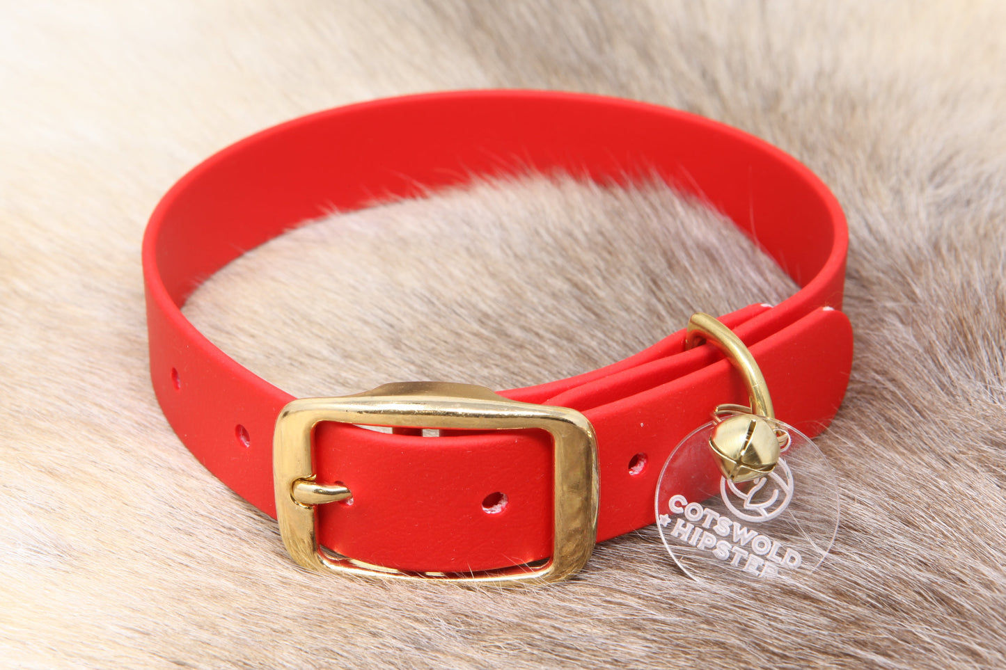 Festive red Biothane dog collar with solid brass hardware