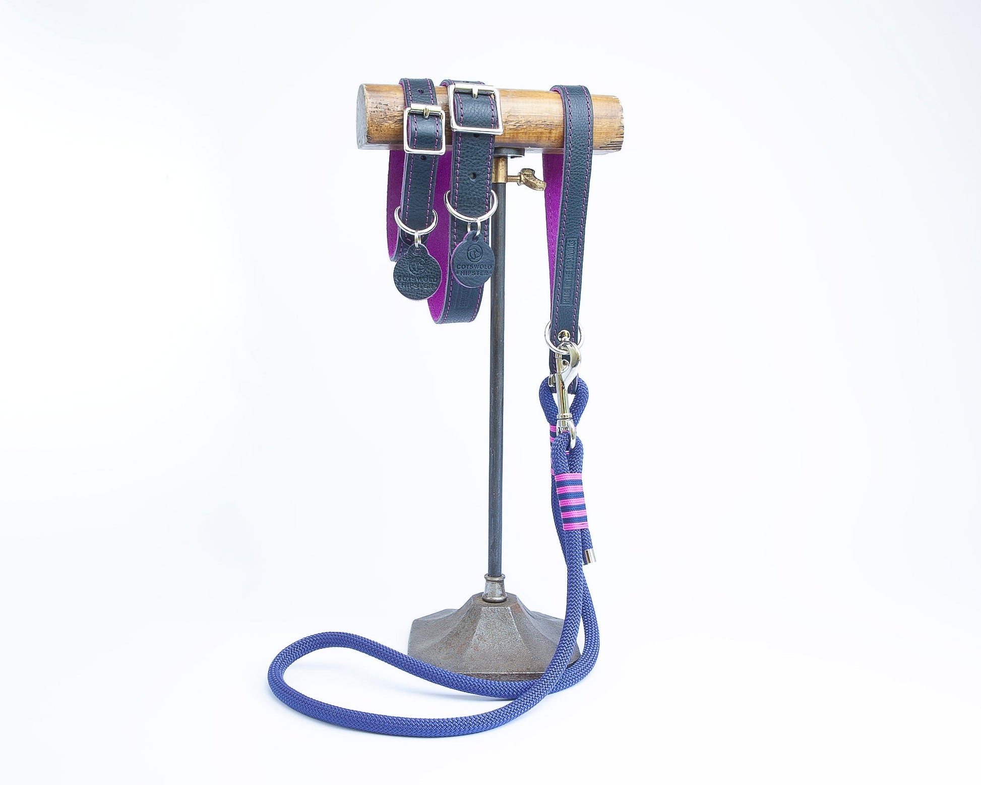 Handmade navy leather dog collars and matching lead with fuchsia detailing from the Summer Fair Collection