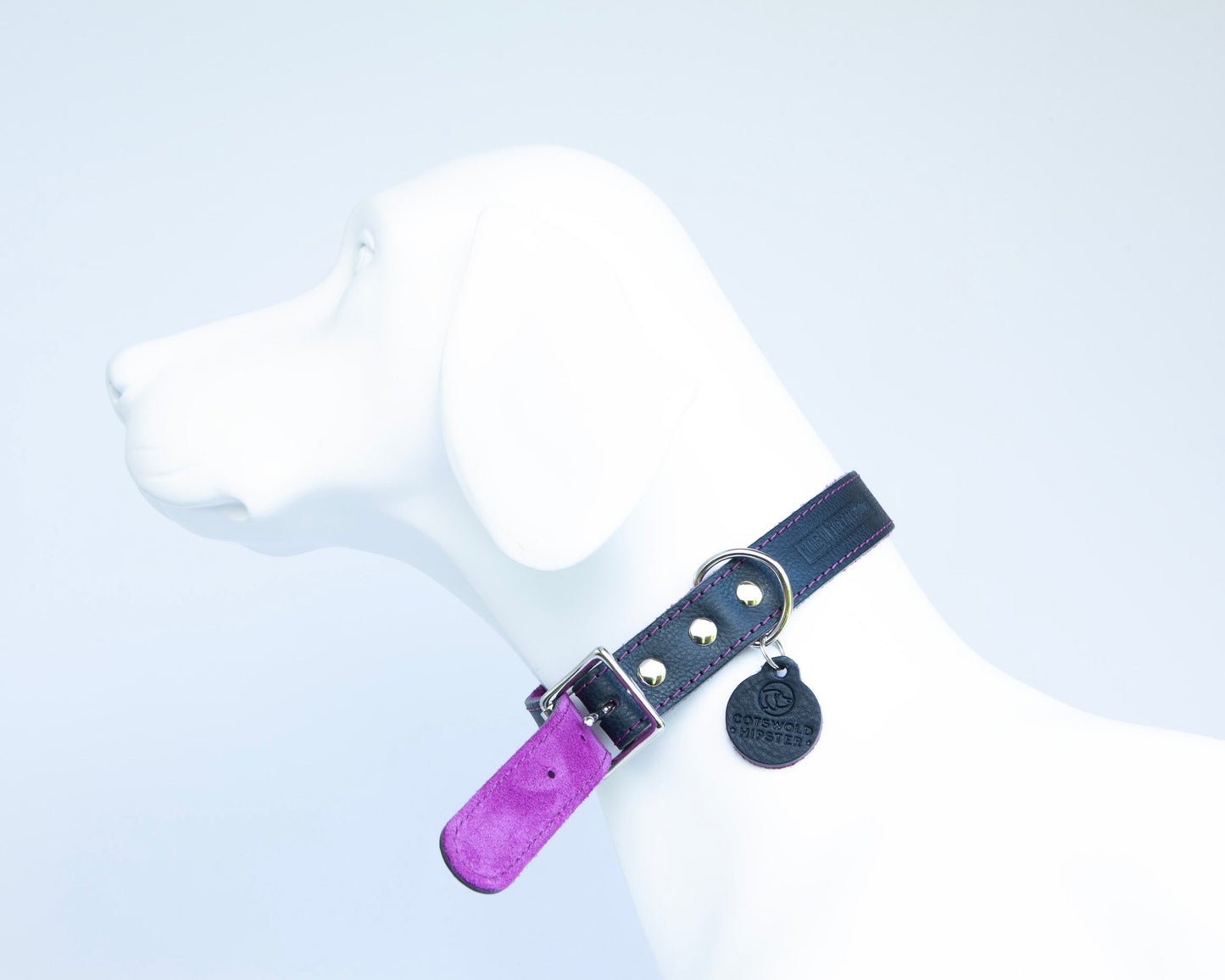 Close-up of fuchsia suede lining on handmade navy leather dog collar from the Summer Fair Collection