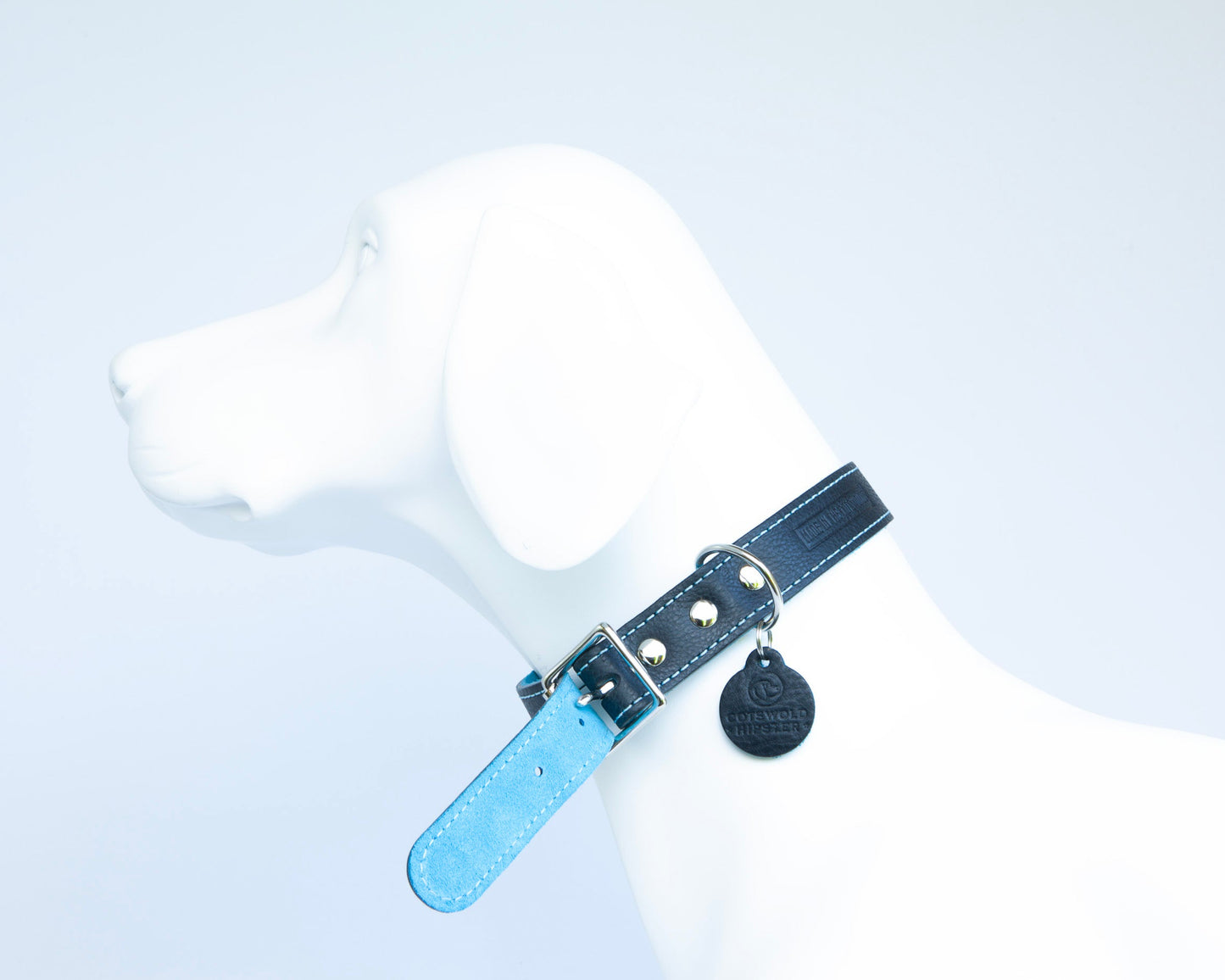 Close-up of turquoise suede lining on handmade navy leather dog collar from the Summer Fair Collection