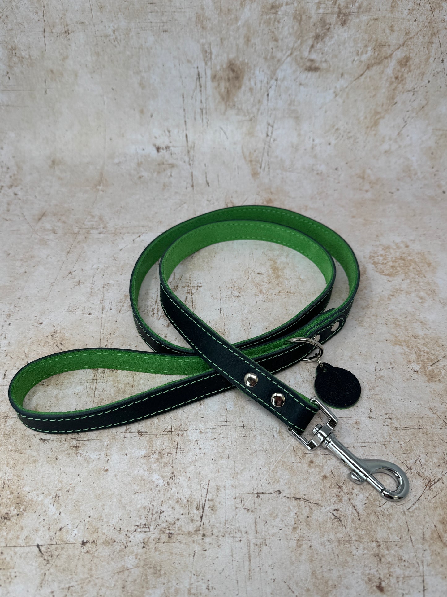 Handmade navy leather dog lead with emerald suede lining and colour-matched stitching from the Summer Fair Collection