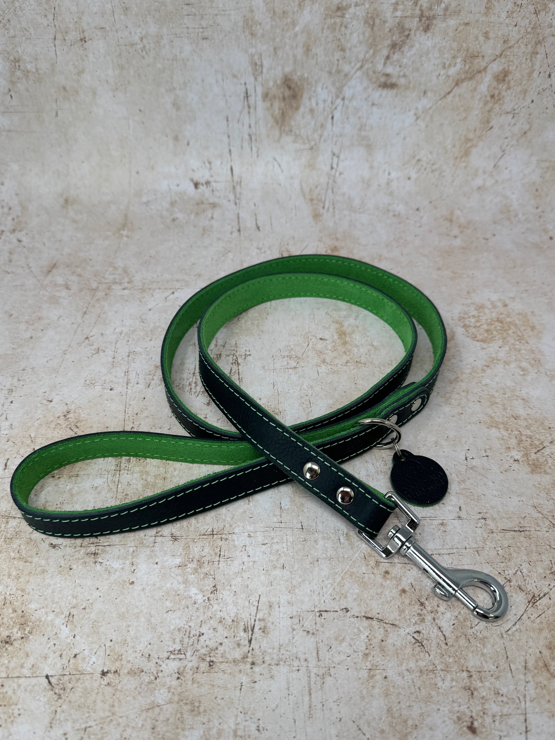 Handmade navy leather dog lead with emerald suede lining and colour-matched stitching from the Summer Fair Collection