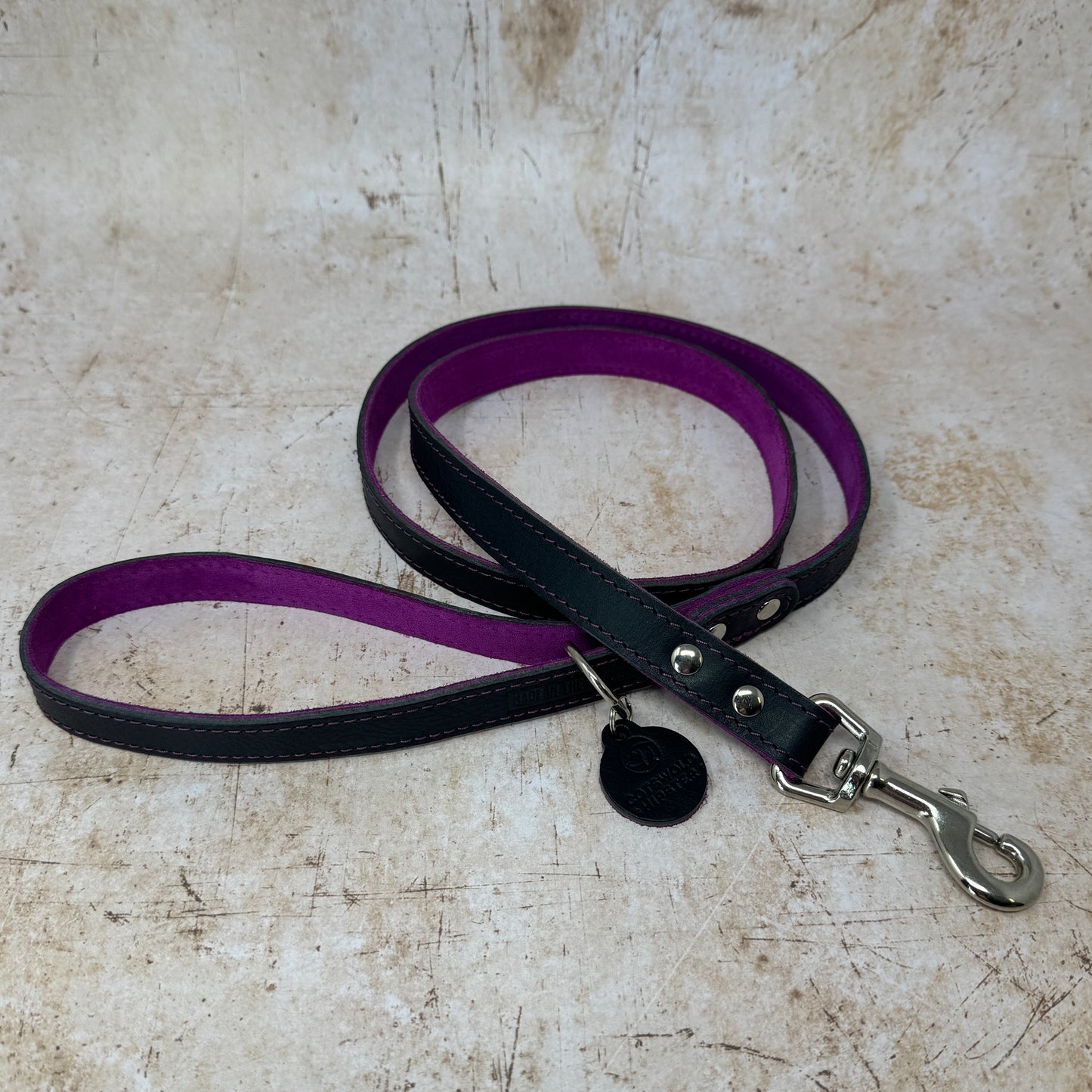 Handmade navy leather dog lead with fuchsia suede lining and colour-matched stitching from the Summer Fair Collection