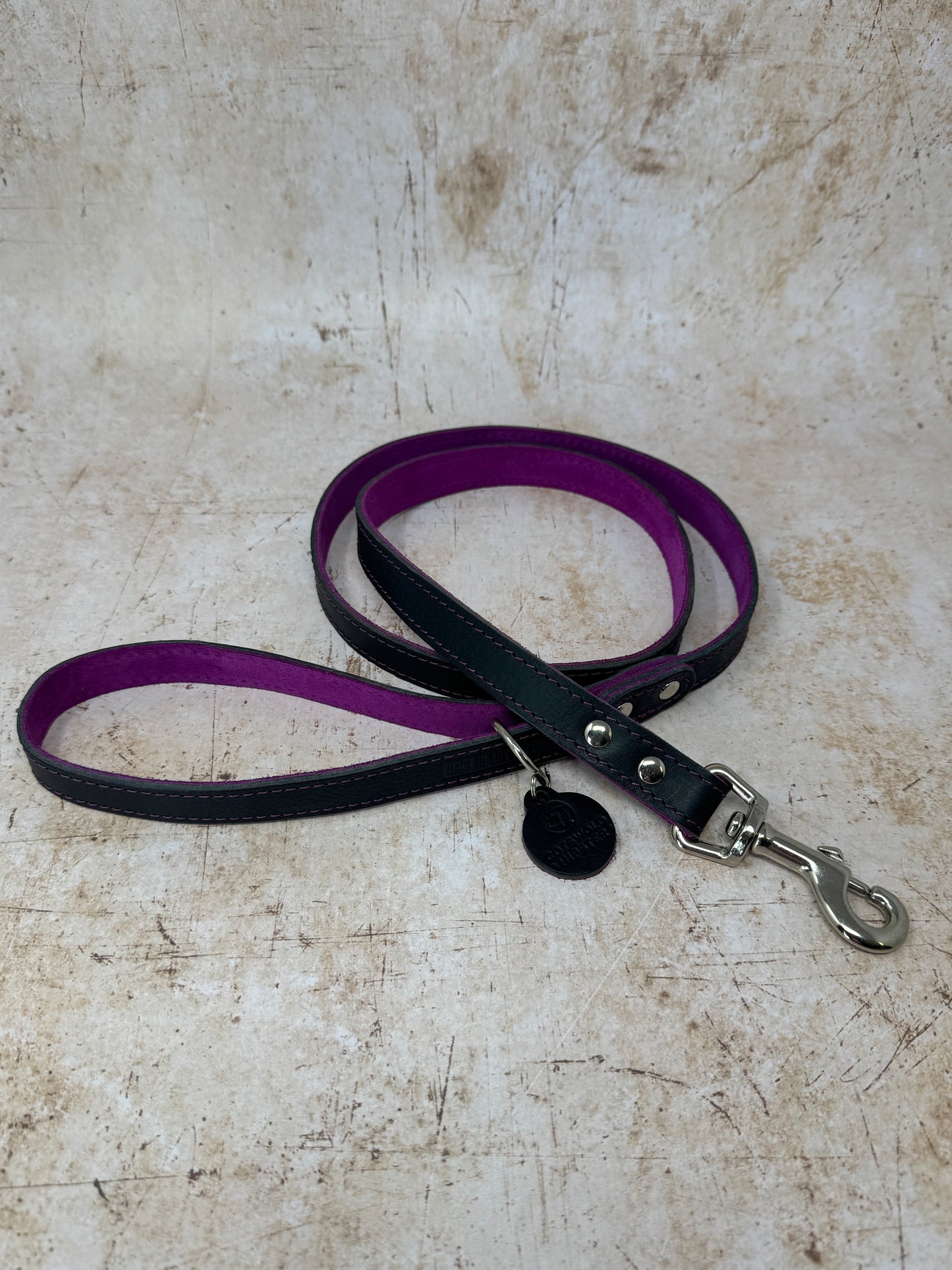 Handmade navy leather dog lead with fuchsia suede lining and colour-matched stitching from the Summer Fair Collection