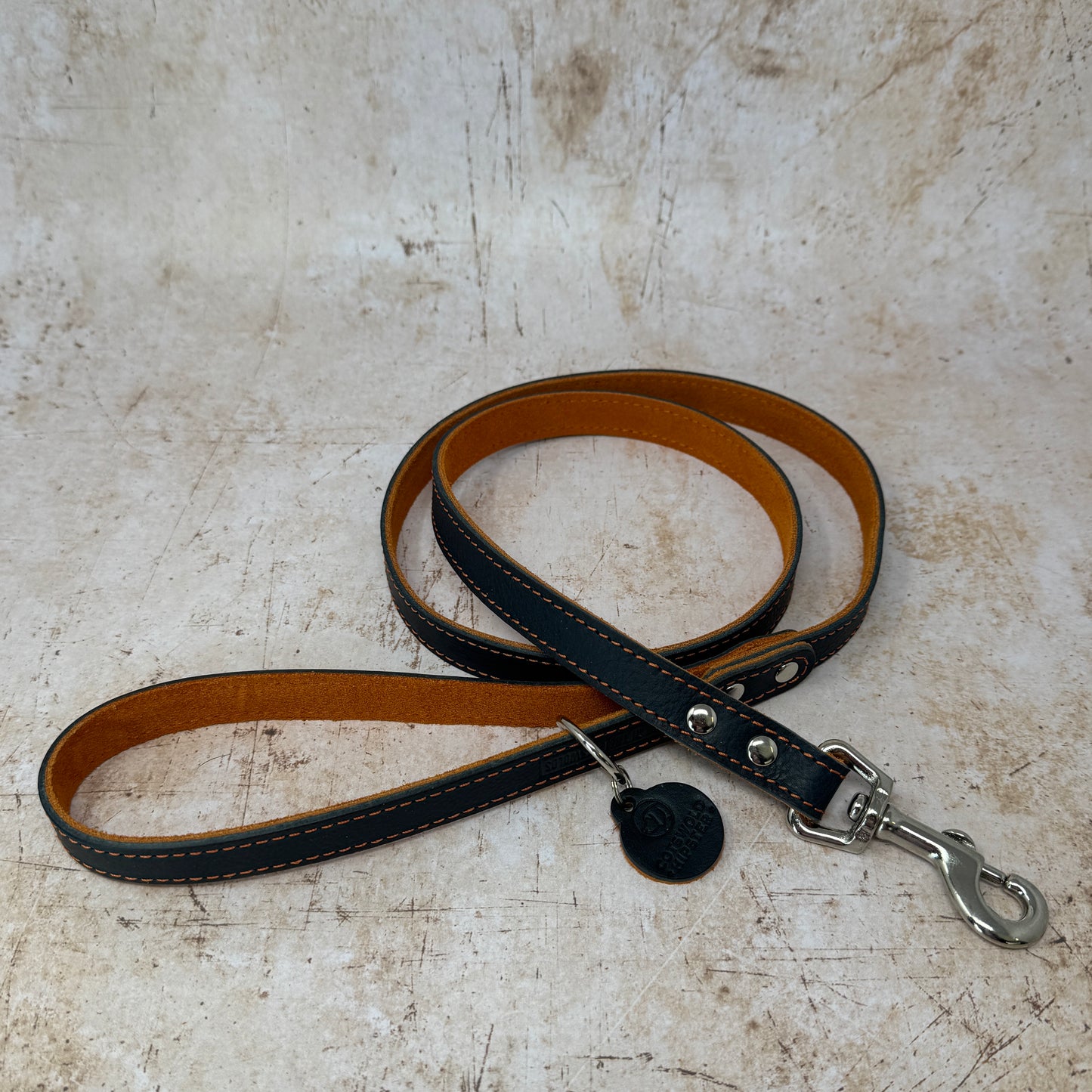 Summer Fair leather dog lead in navy with tangerine suede lining and colour-matched stitching
