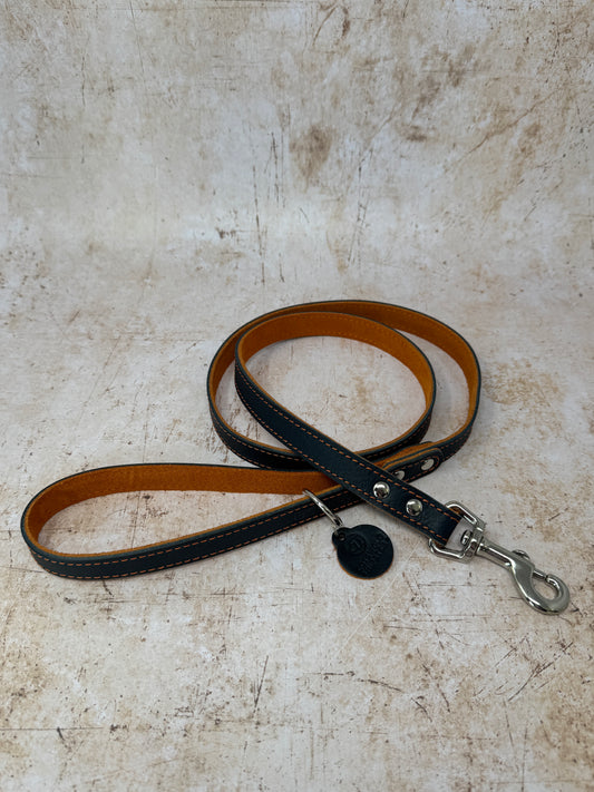 Handmade navy leather dog lead with tangerine suede lining and colour-matched stitching from the Summer Fair Collection