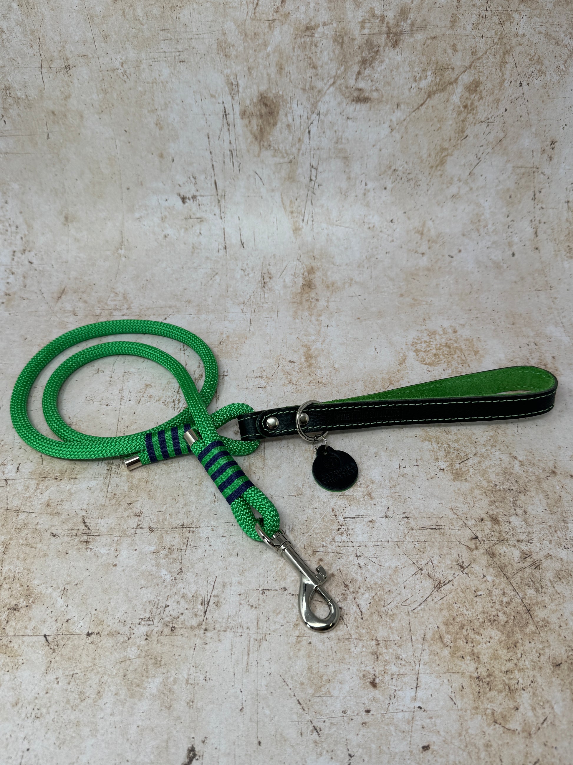 Handmade leather and rope dog lead with emerald rope, navy leather handle and emerald suede lining from the Summer Fair Collection