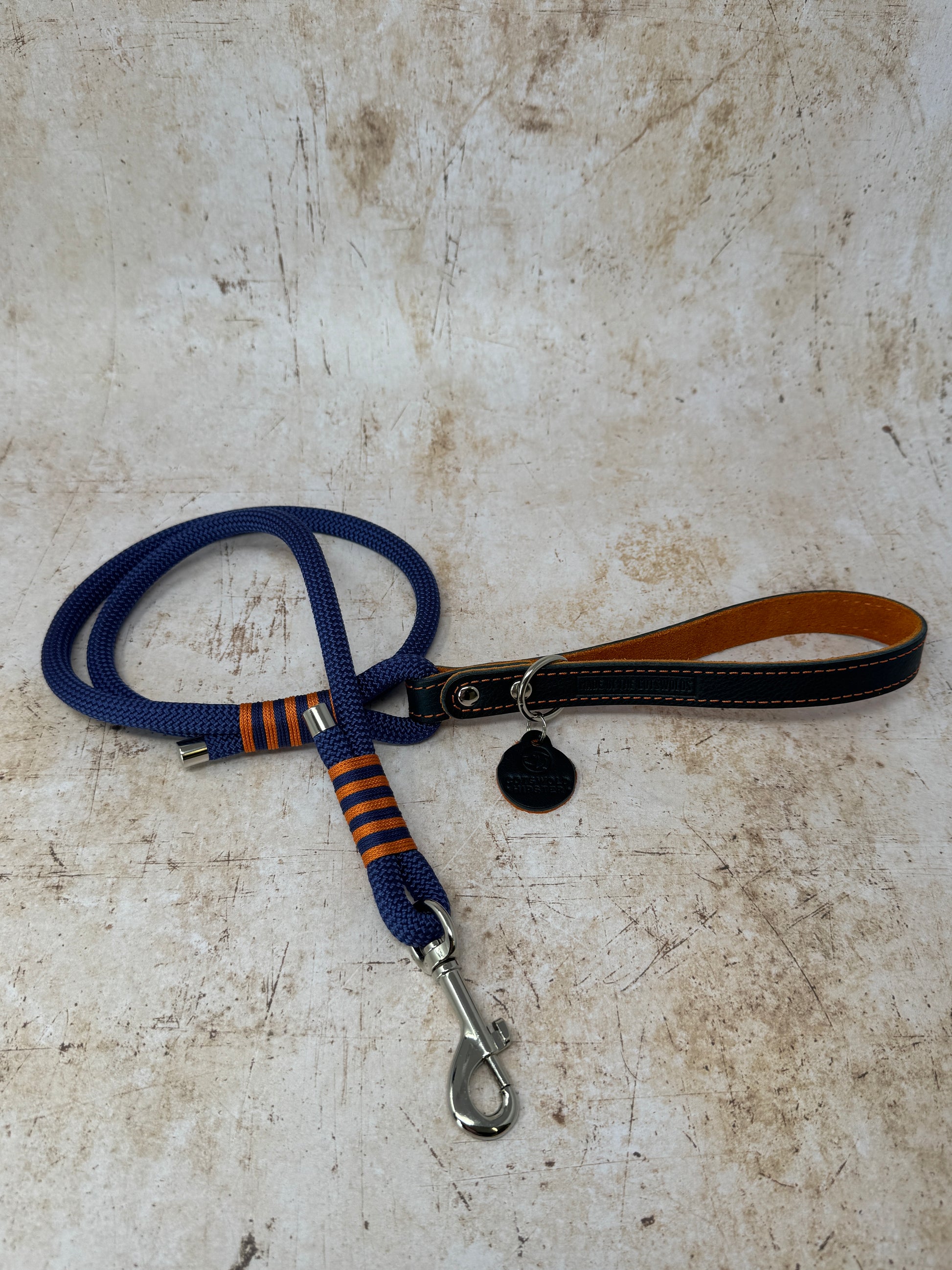 Handmade leather and rope dog lead with navy rope, navy leather handle and tangerine suede lining from the Summer Fair Collection