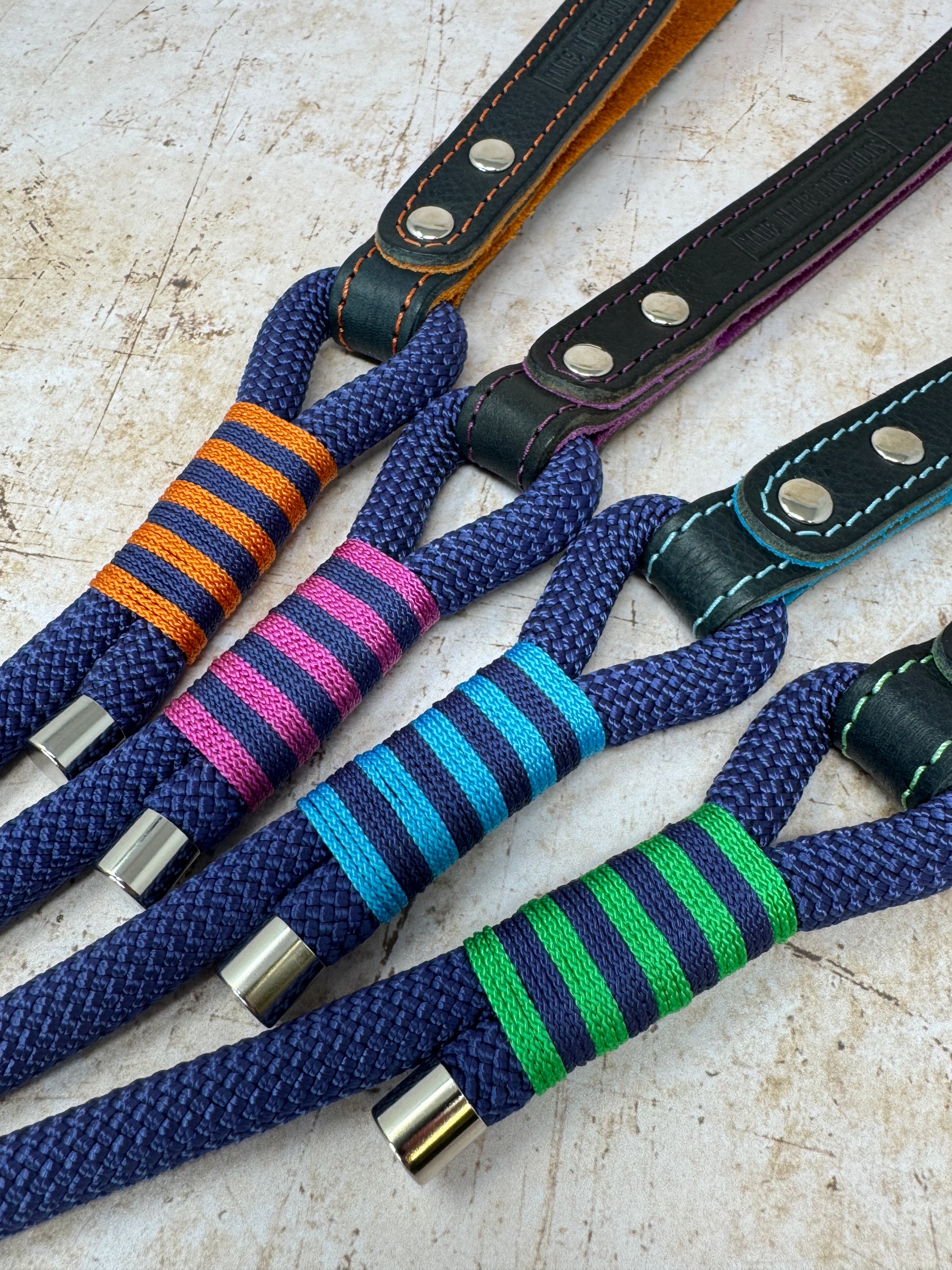 Close-up of signature stripe whipping detail on handmade leather and rope dog leads from the Summer Fair Collection