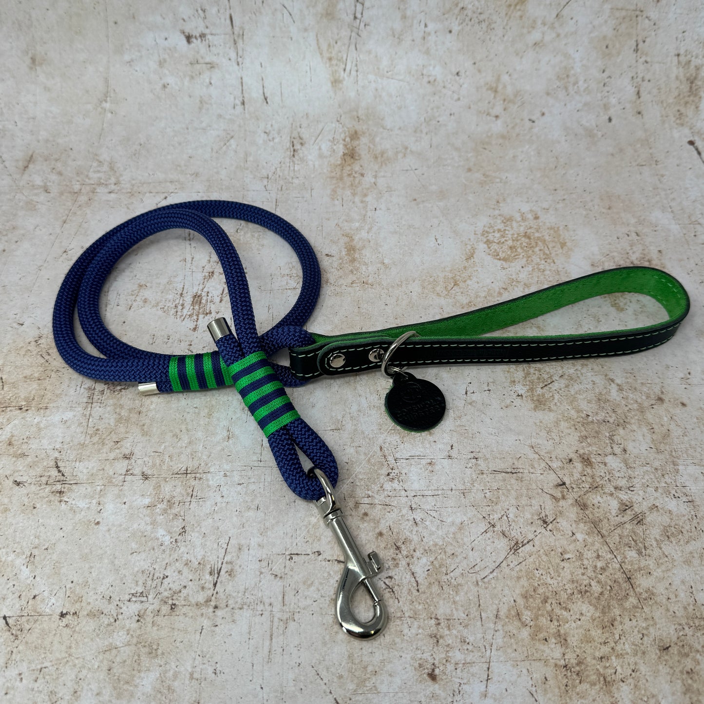 Handmade rope dog lead in French navy with emerald stripe detailing and leather handle from the Summer Fair Collection