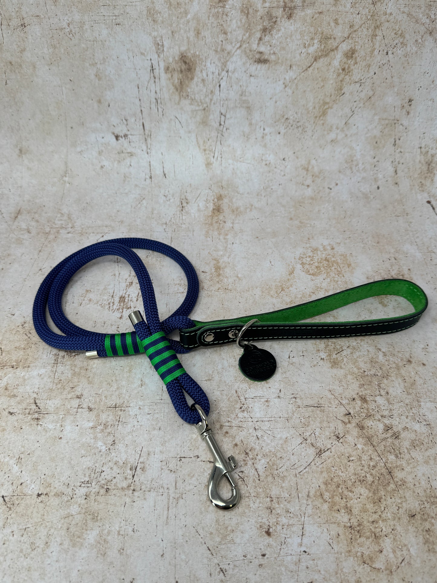 Handmade rope dog lead in French navy with emerald stripe detailing and leather handle from the Summer Fair Collection