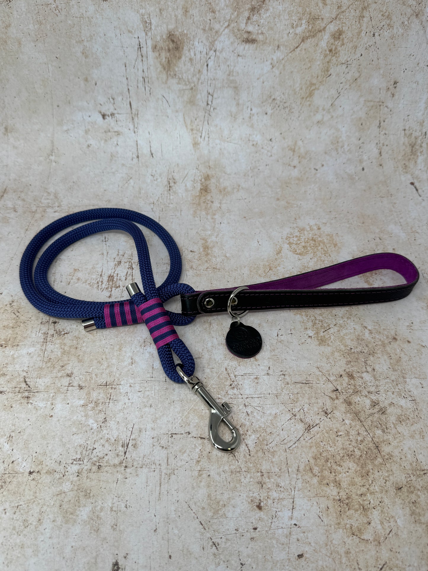 Handmade rope dog lead in French navy with fuchsia stripe detailing and leather handle from the Summer Fair Collection