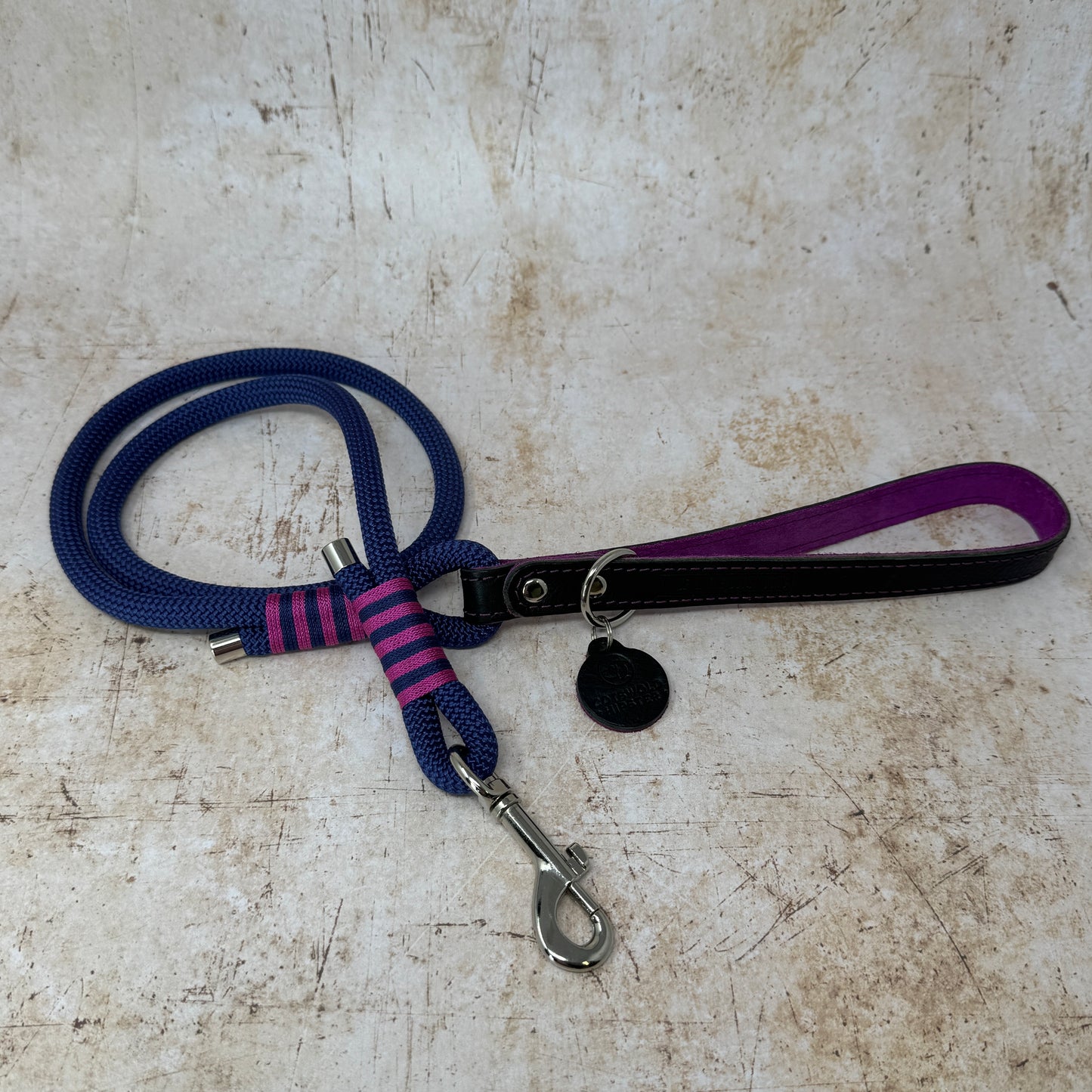 Handmade leather and rope dog lead with navy rope, navy leather handle and fuchsia suede lining from the Summer Fair Collection