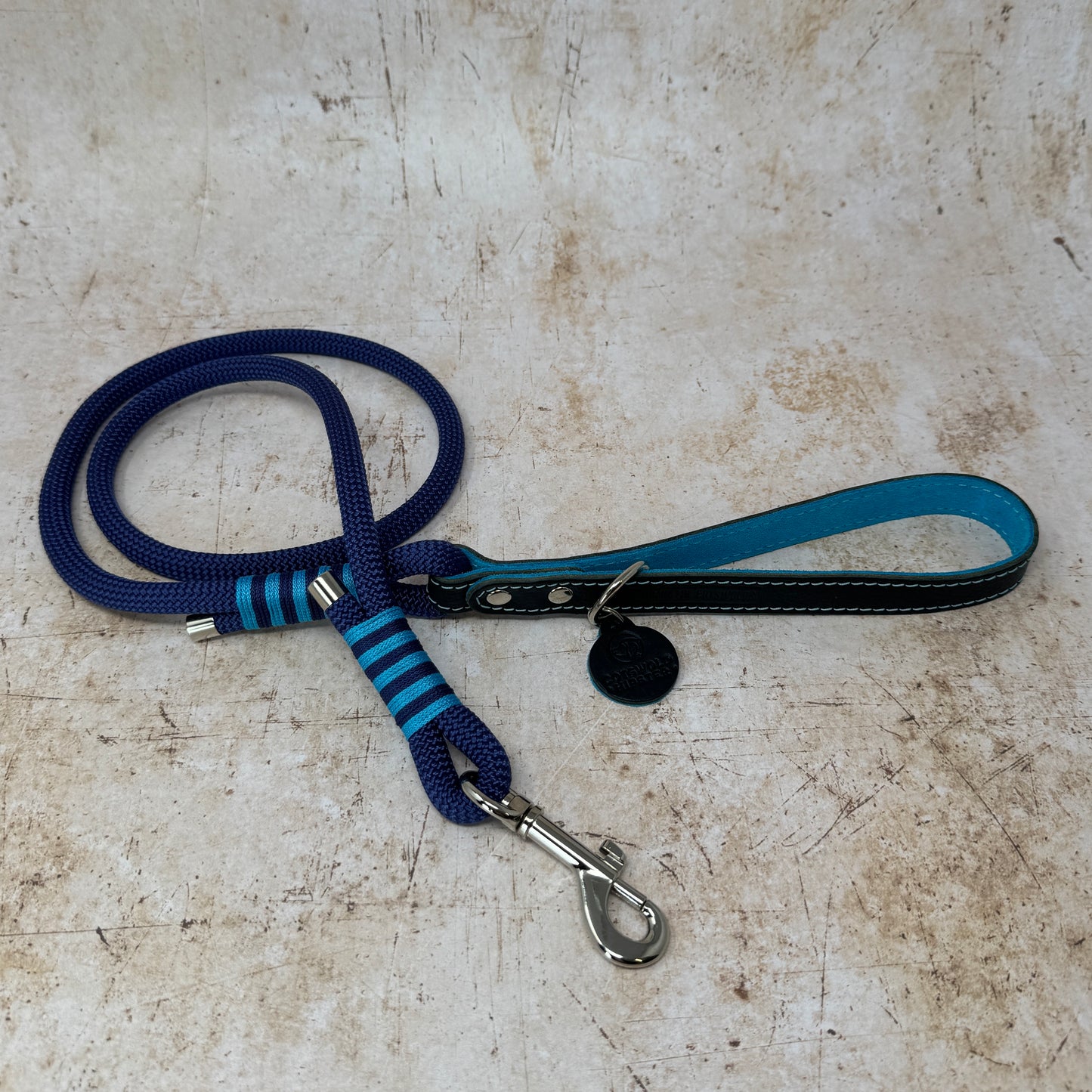 Handmade leather and rope dog lead with navy rope, navy leather handle and turquoise suede lining from the Summer Fair Collection
