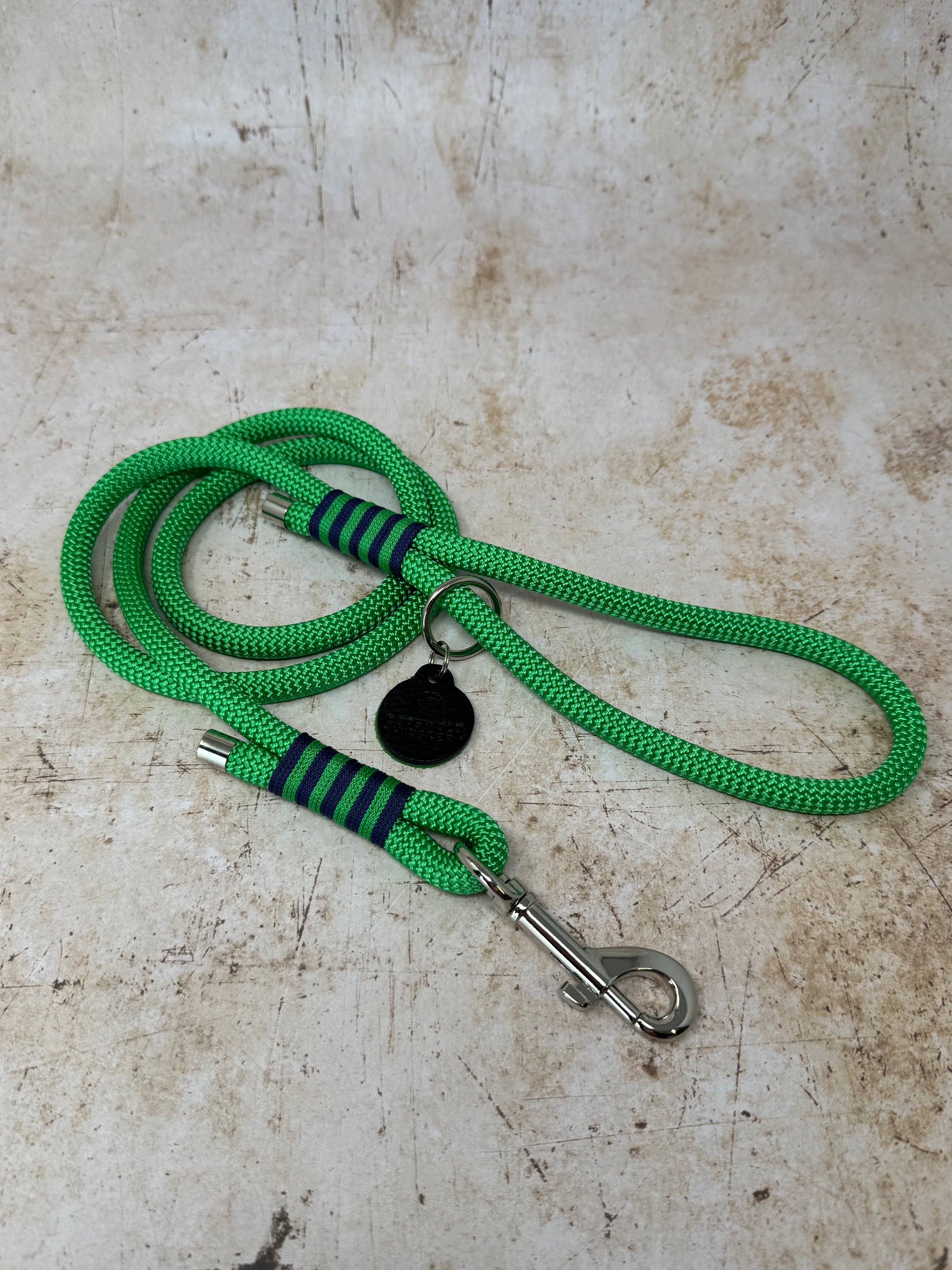 Handmade rope-handle dog lead in French navy with bold emerald stripe detailing and nickel hardware from the Summer Fair Collection