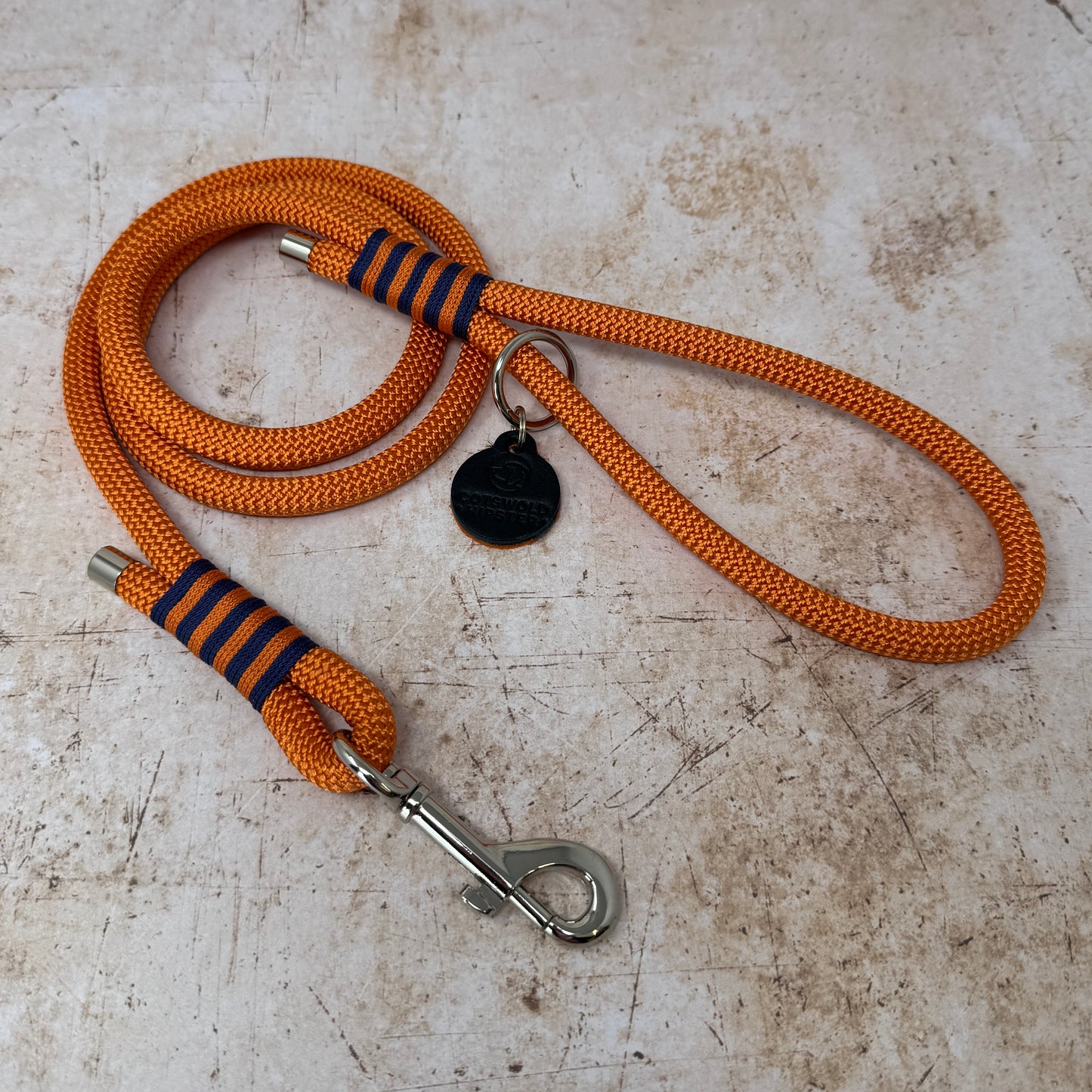 Summer Fair rope-handle dog lead in French navy with bold tangerine stripe detailing and nickel hardware