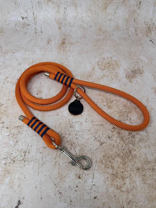 Handmade rope-handle dog lead in French navy with bold tangerine stripe detailing and nickel hardware from the Summer Fair Collection