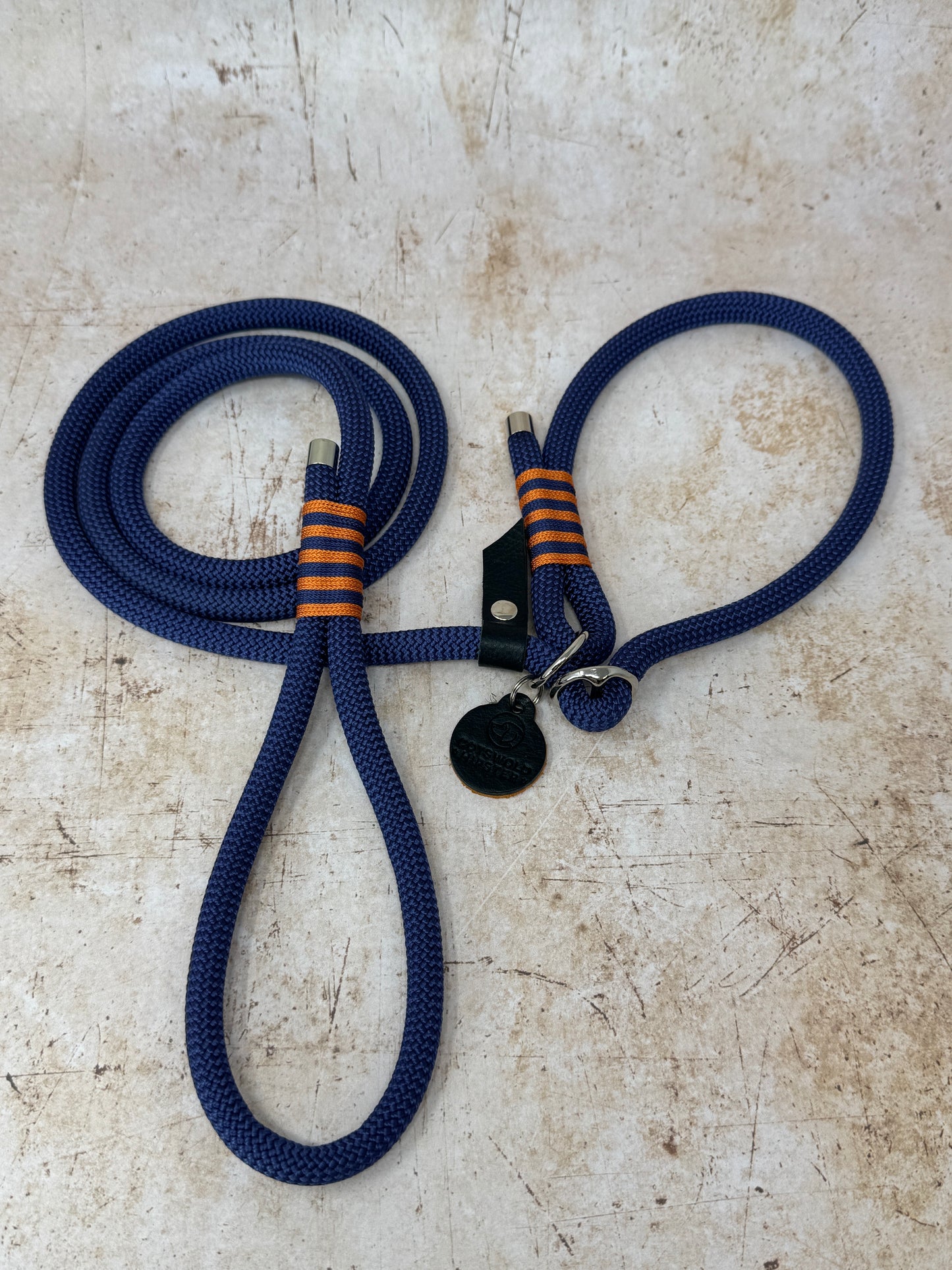 Handmade rope slip lead in French navy with bold tangerine stripe detailing and nickel hardware from the Summer Fair Collection