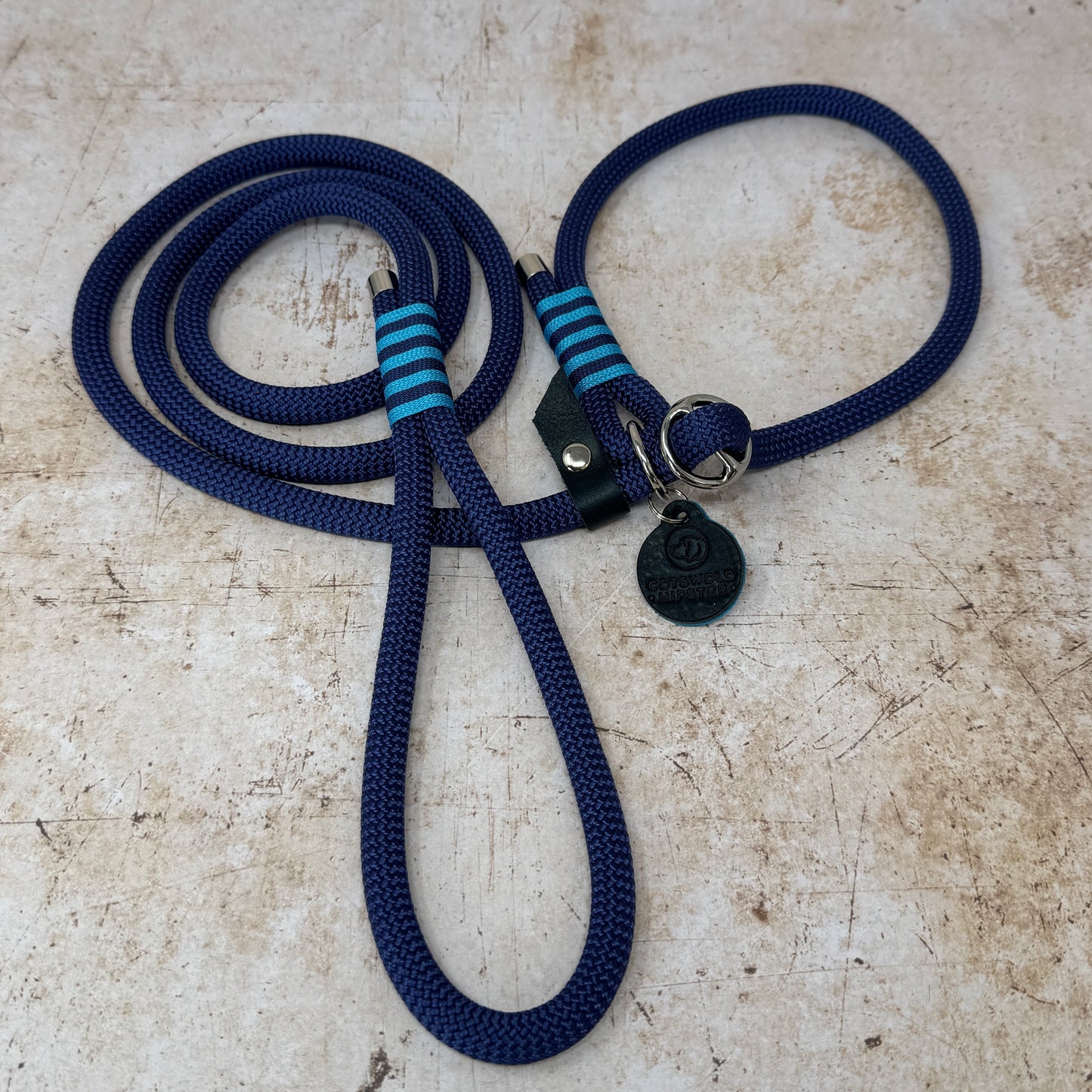 Handmade rope slip lead in French navy with bold turquoise stripe detailing and nickel hardware from the Summer Fair Collection