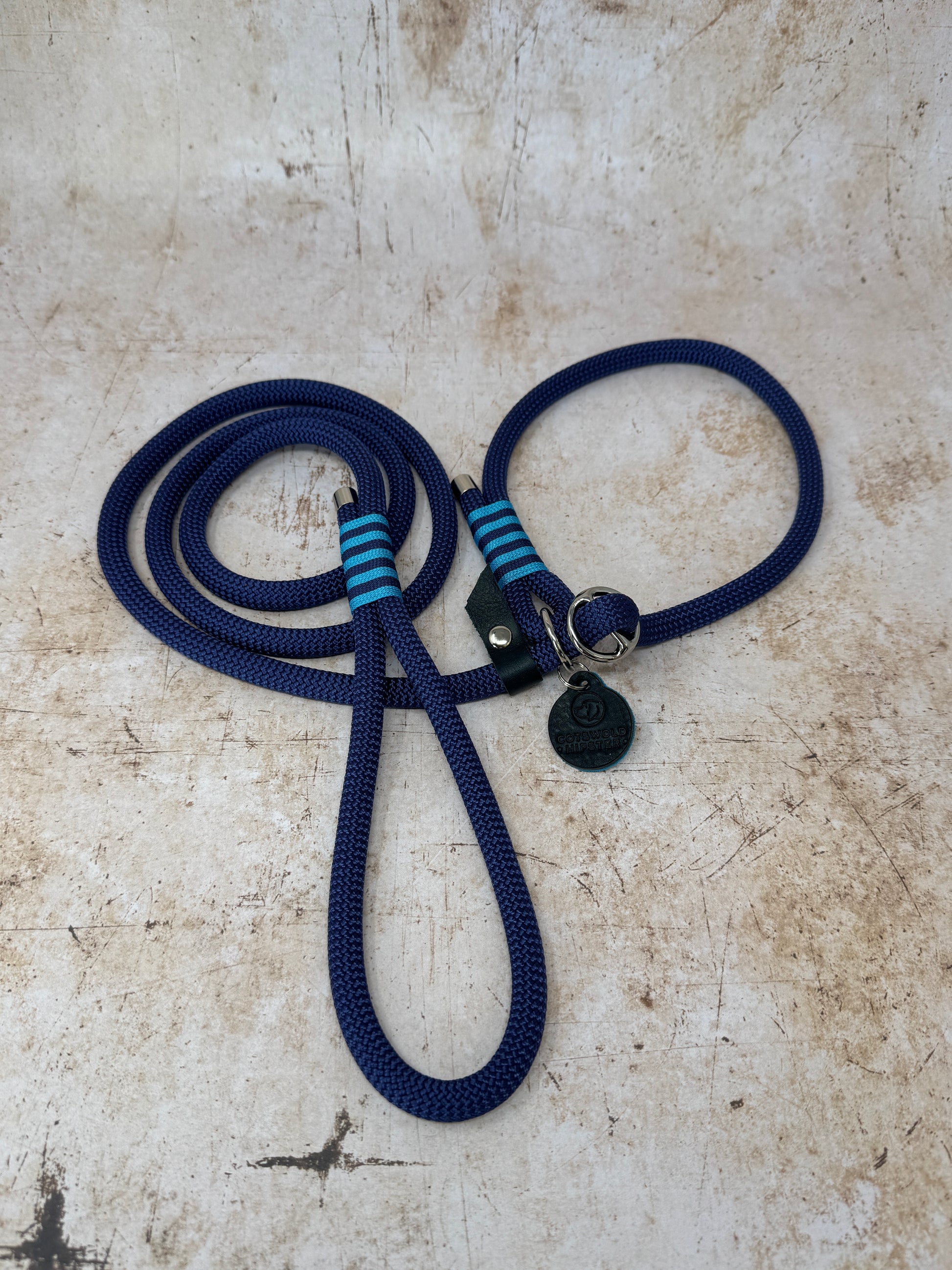 Handmade rope slip lead in French navy with bold turquoise stripe detailing and nickel hardware from the Summer Fair Collection